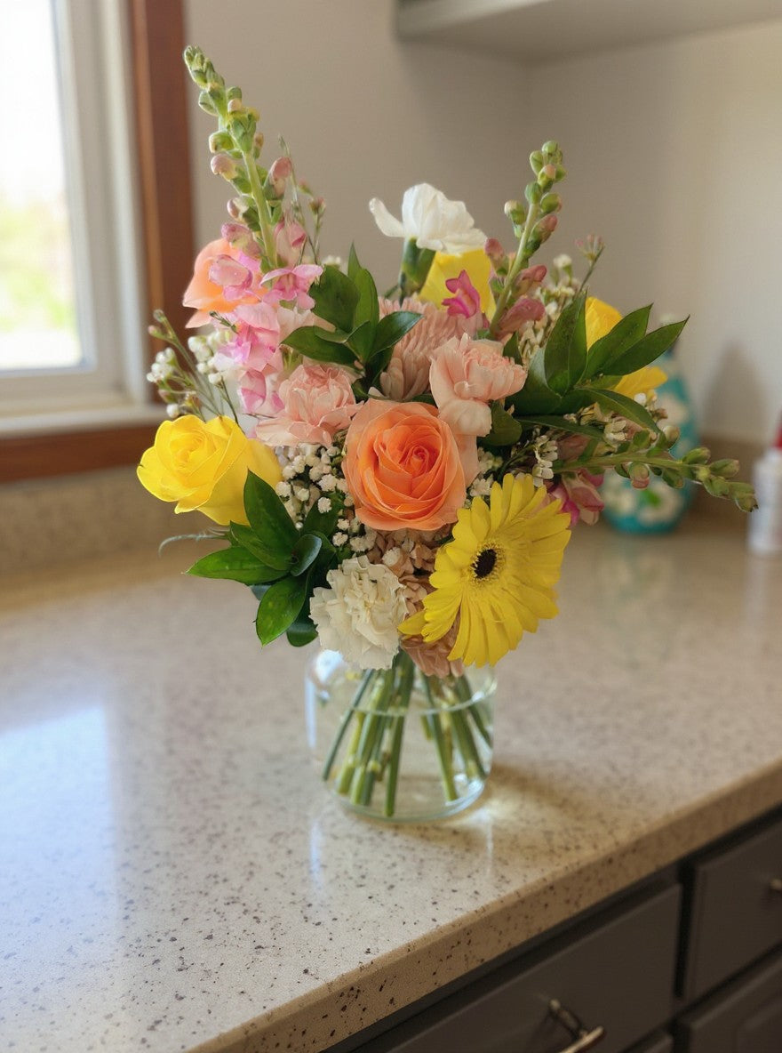 Lakewood Florist Peach and Cream Sunset bouquet with roses, snapdragons, carnations, and gerbera daisies.