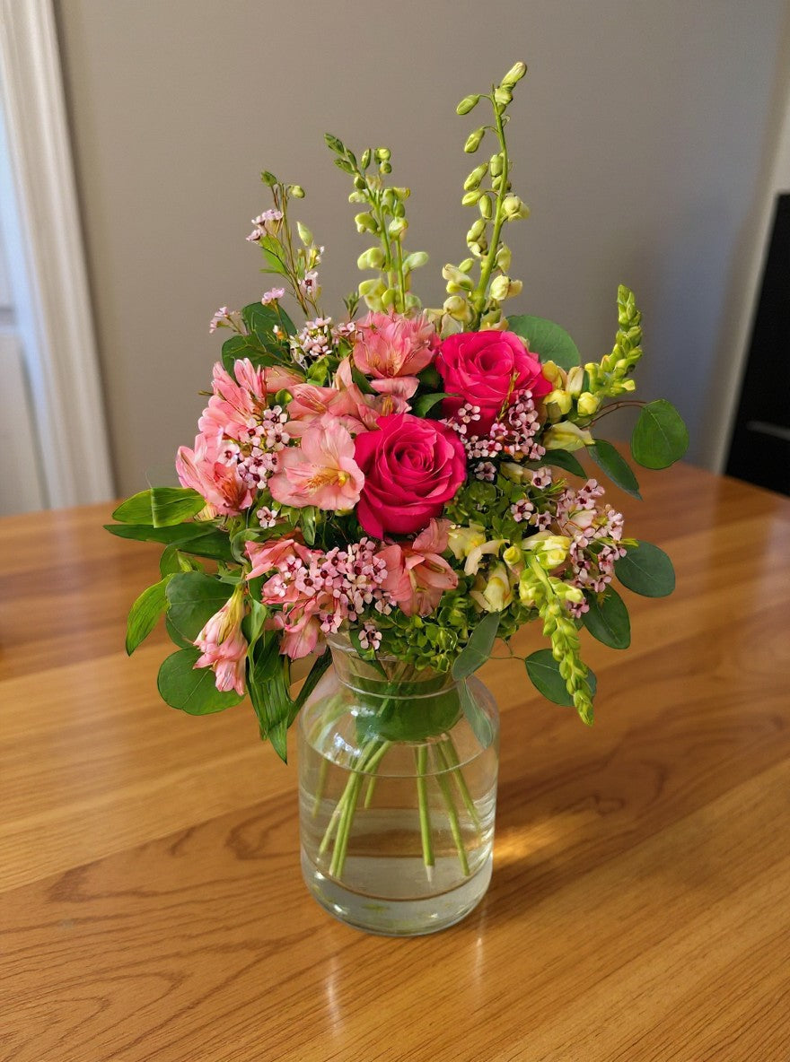Lakewood Florist Strawberry Matcha Bouquet: vibrant pink roses, alstroemeria, snapdragons, and delicate pink filler flowers.