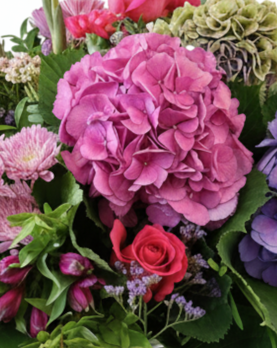 Lakewood Florist Sensational Summer Vase featuring a lush European-style bouquet with pink hydrangeas and roses.